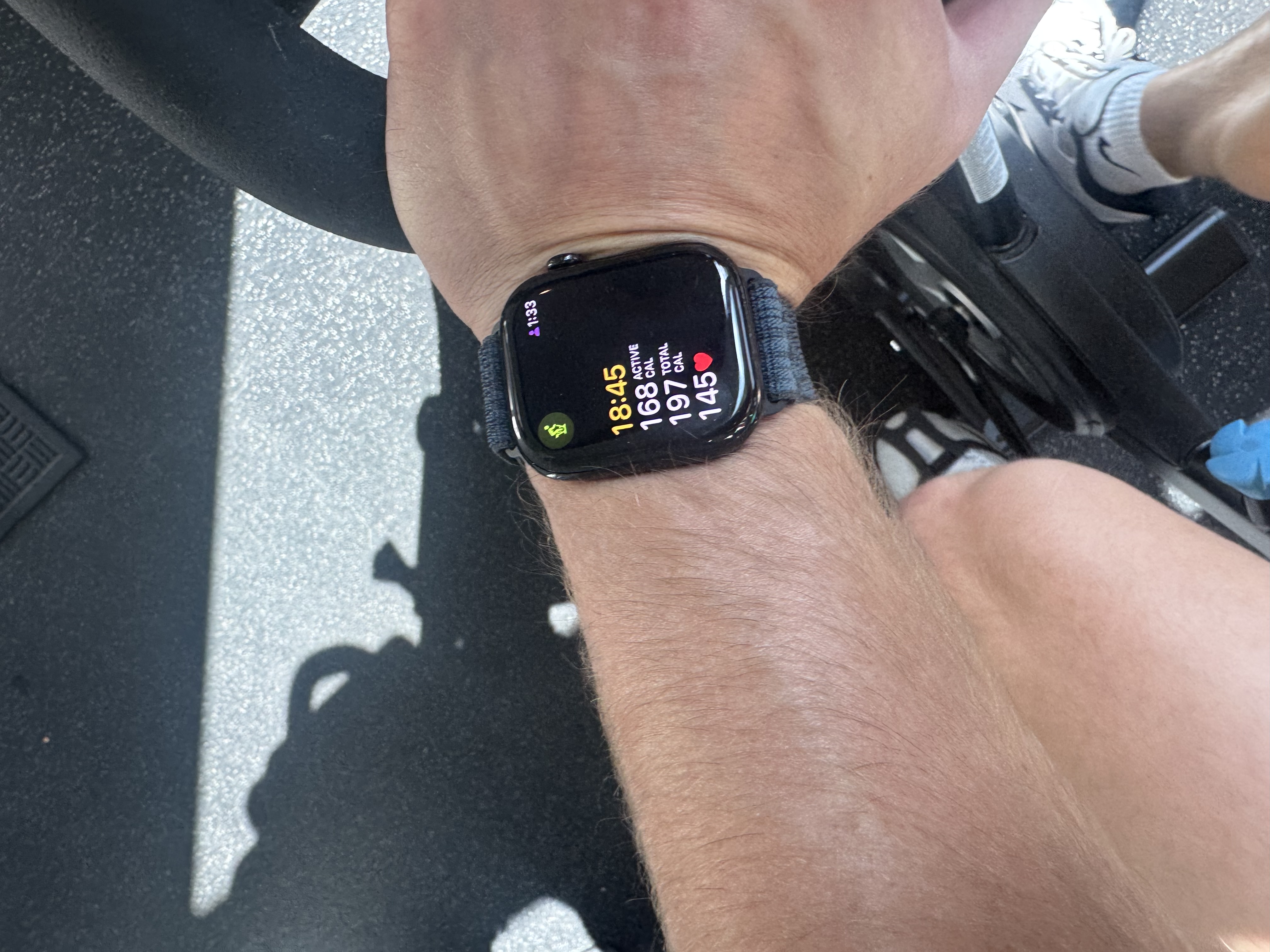 Apple Watch showing workout stats during cycling